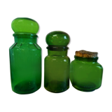 Trio of green glass apothecary bottles
