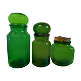 Trio of green glass apothecary bottles