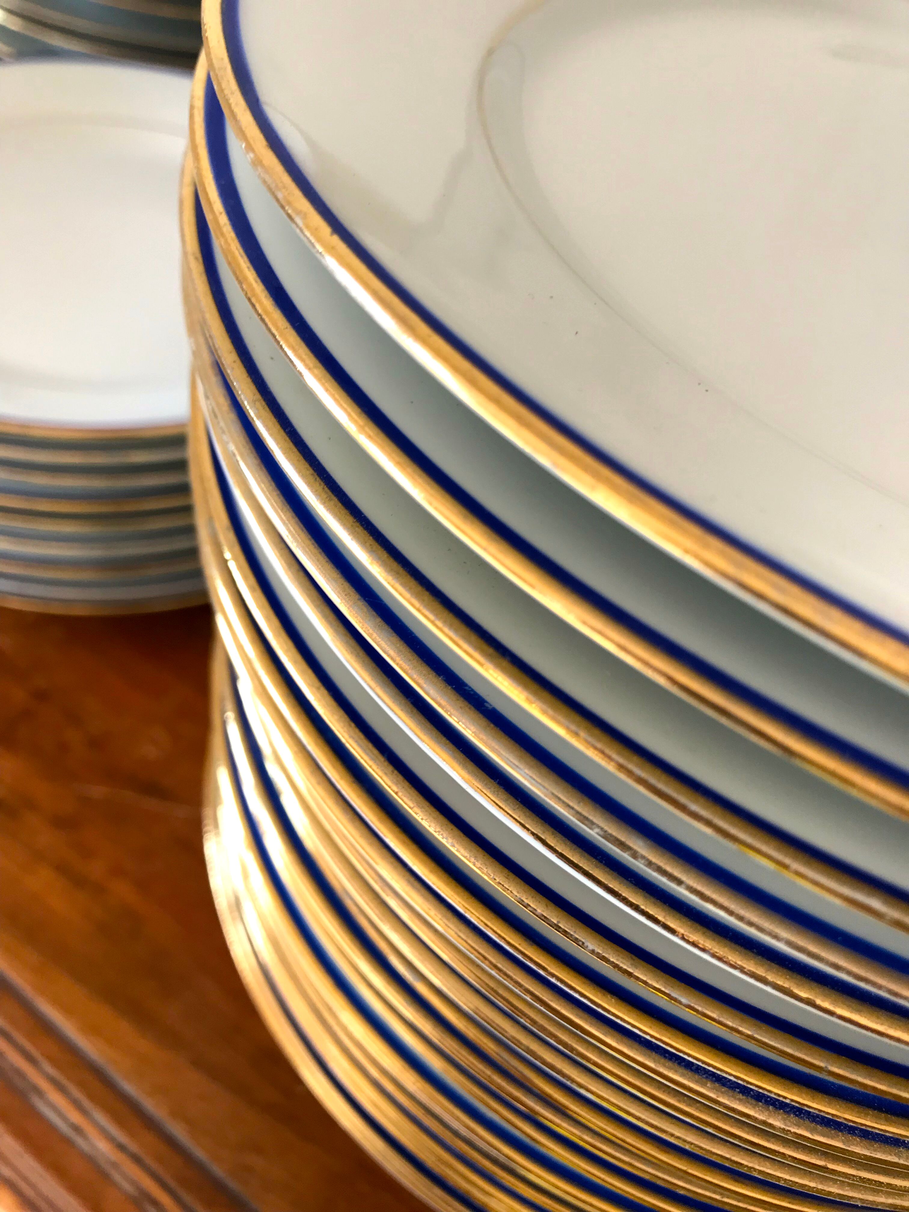 table service art deco limoges porcelain white border blue and gold 61 pieces signed