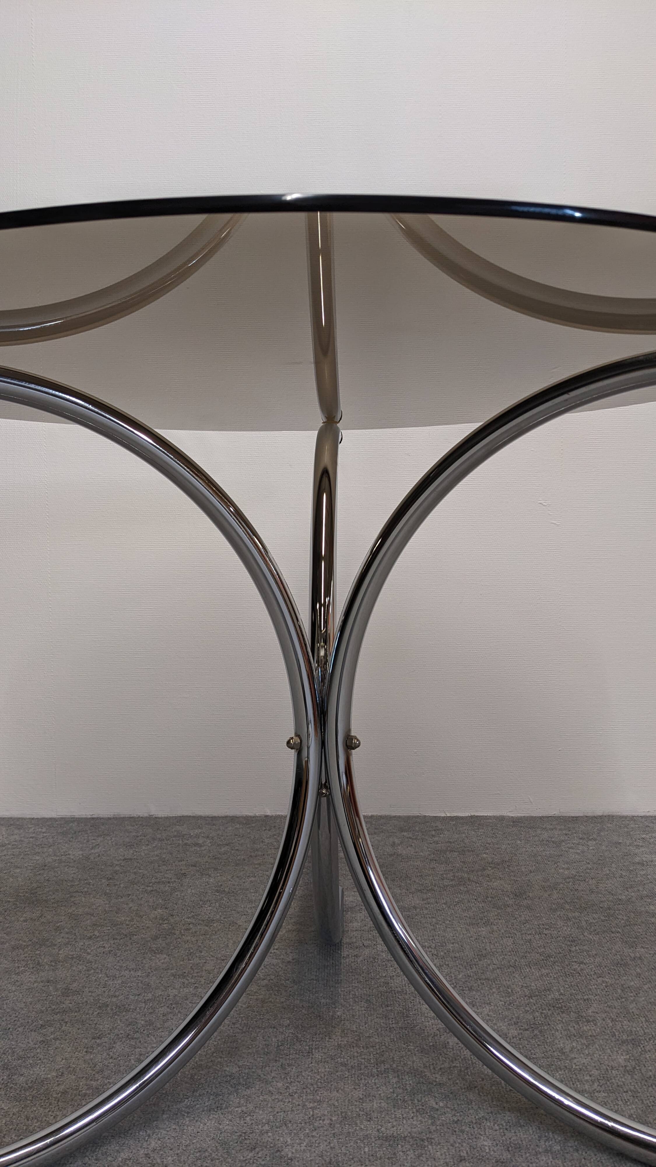 Chrome metal and smoked glass round table, Italy circa 1970.