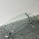 Design coffee table in brushed metal with a glass top, 1970s.