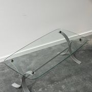 Design coffee table in brushed metal with a glass top, 1970s.