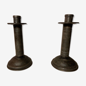 Pair of tin candlesticks