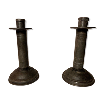 Pair of tin candlesticks