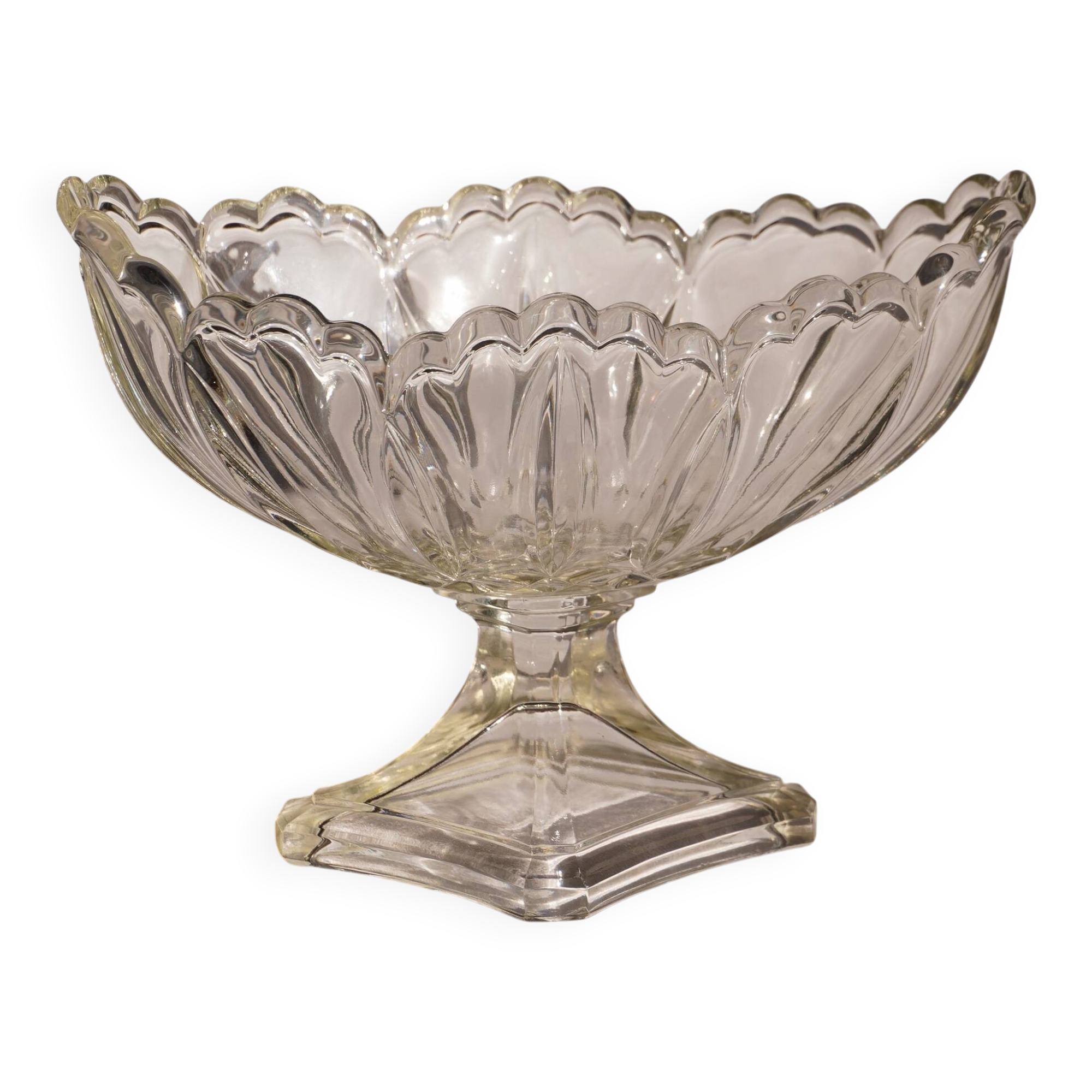 Oval glass fruit bowl on a stand.