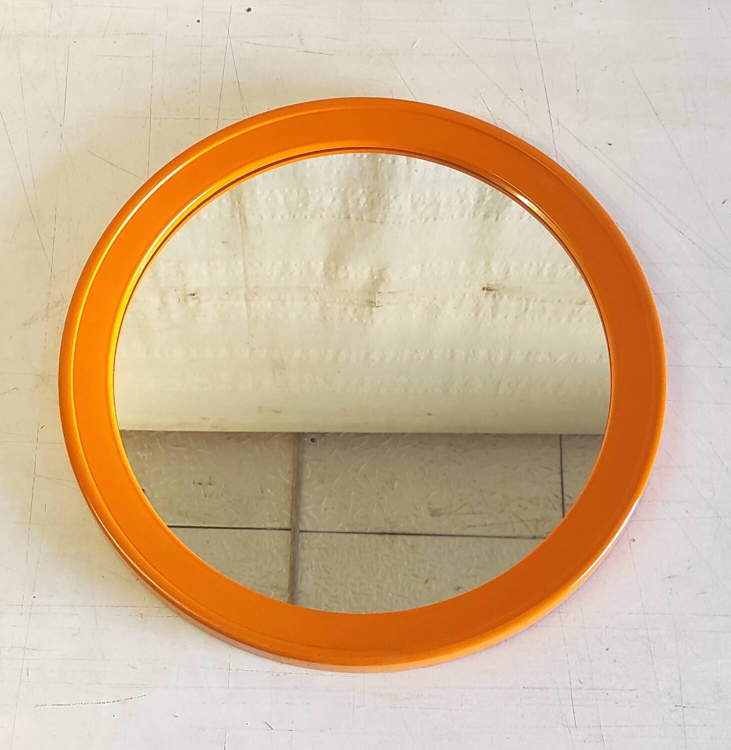 Round orange plastic mirror - 1970s