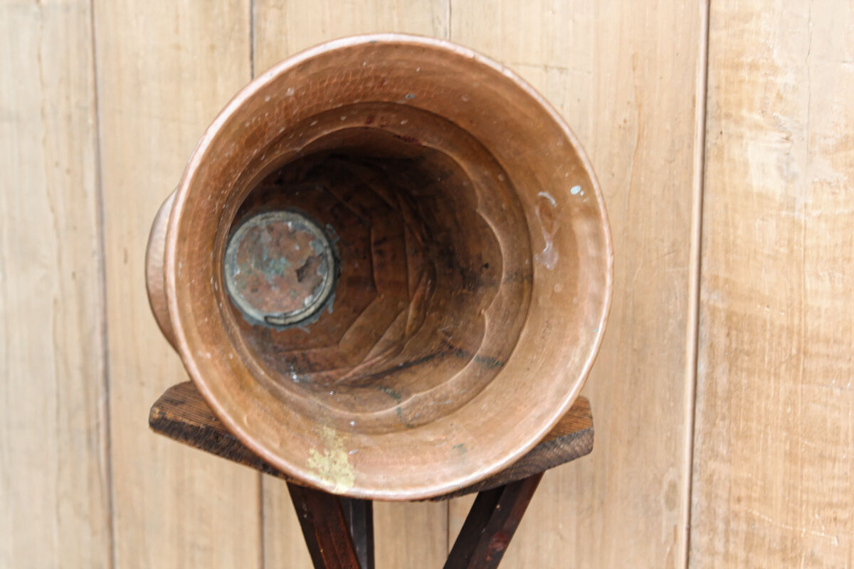 Copper vase hammered on pedestal