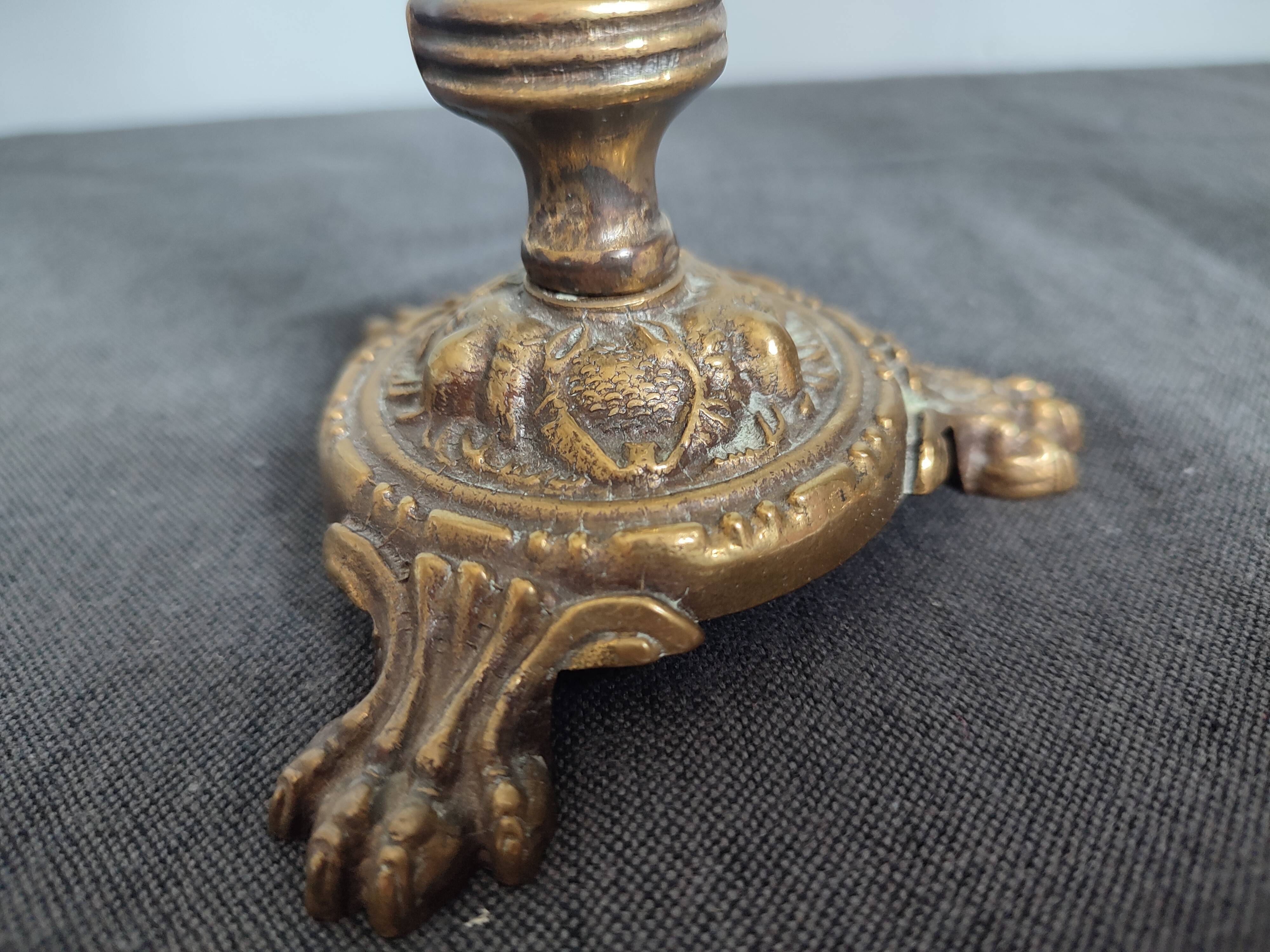 Pair of antique candlesticks in cherub bronze