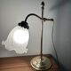 Articulated brass lamp with glass shade, early 20th century.