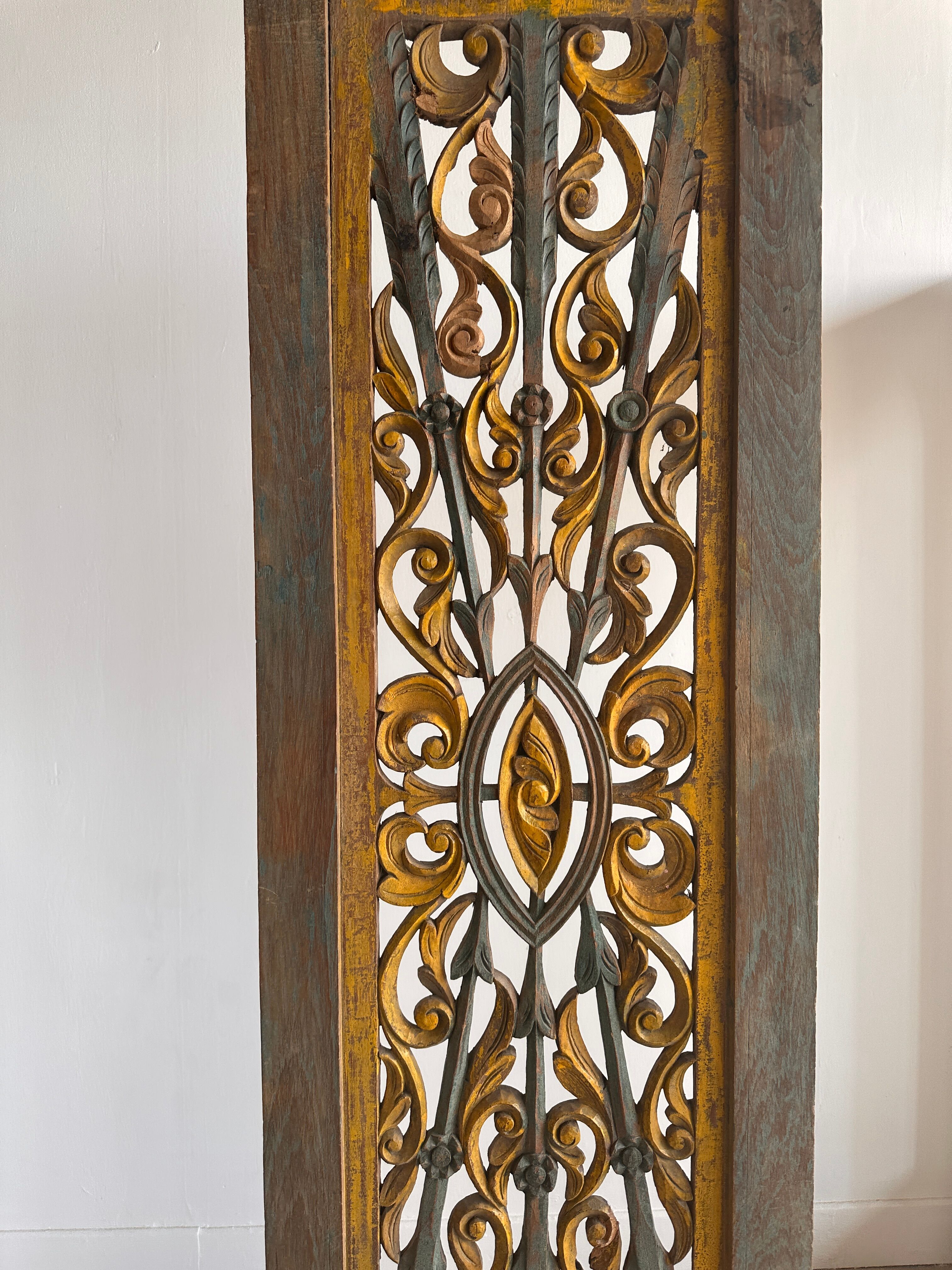 Rectangular Indonesian construction element with blue and yellow plant in carved wood