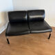 Vintage 2-seater banquette in black faux leather – 1980s