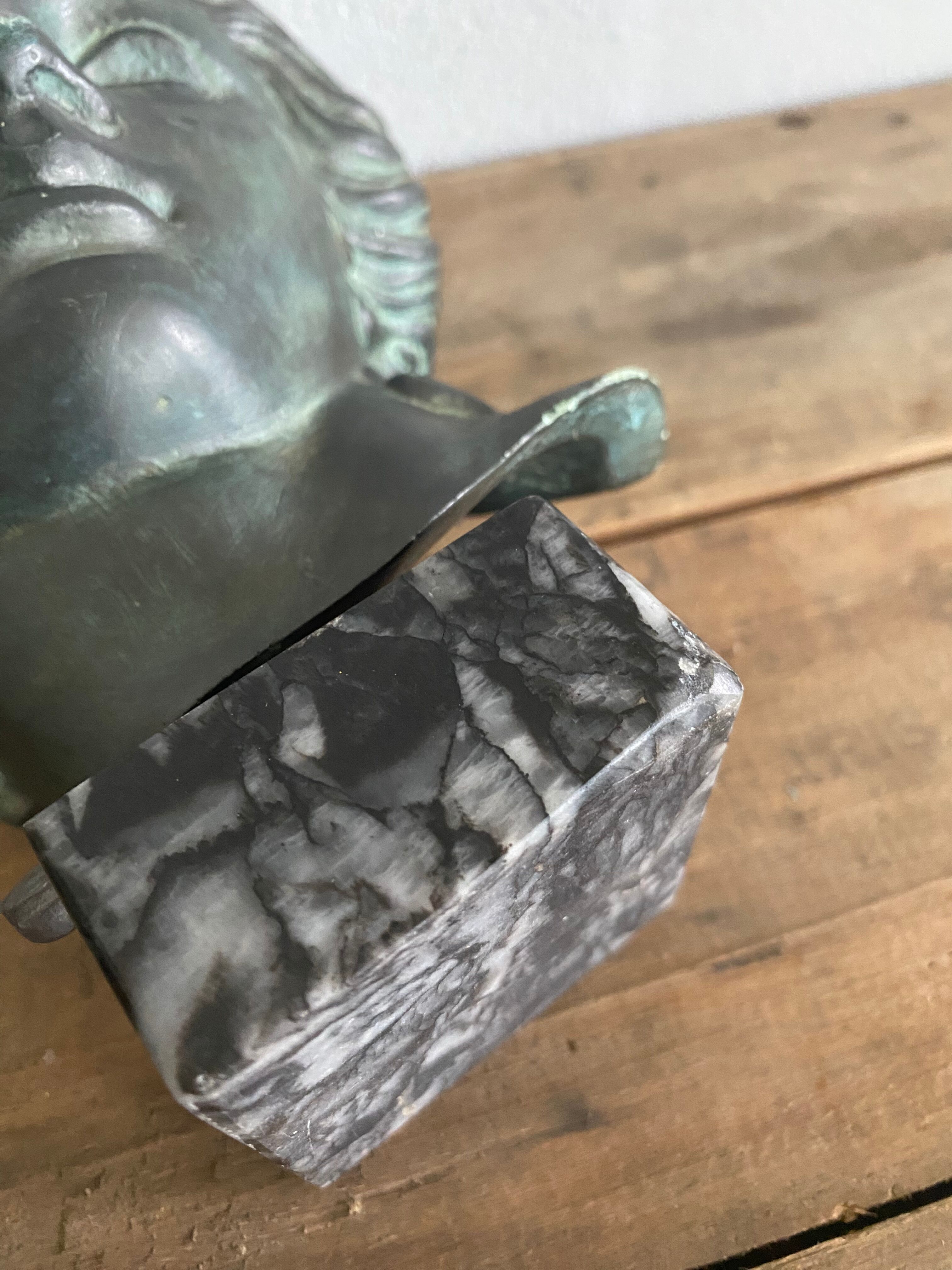 Greek head in patinated plaster with marble base