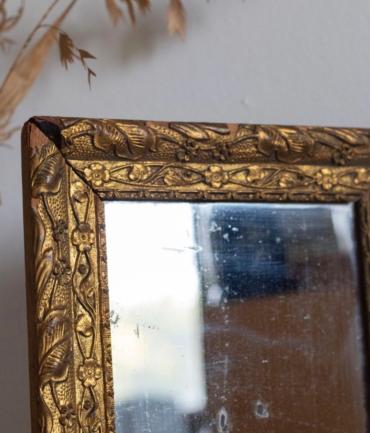Antique mirror in gilded wood