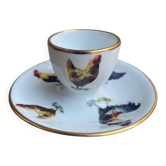 Egg cup in faience from Mehun, decorated with hens, roosters, and soft-boiled eggs.