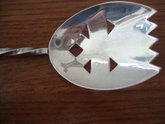 Silver metal sprinkling spoon