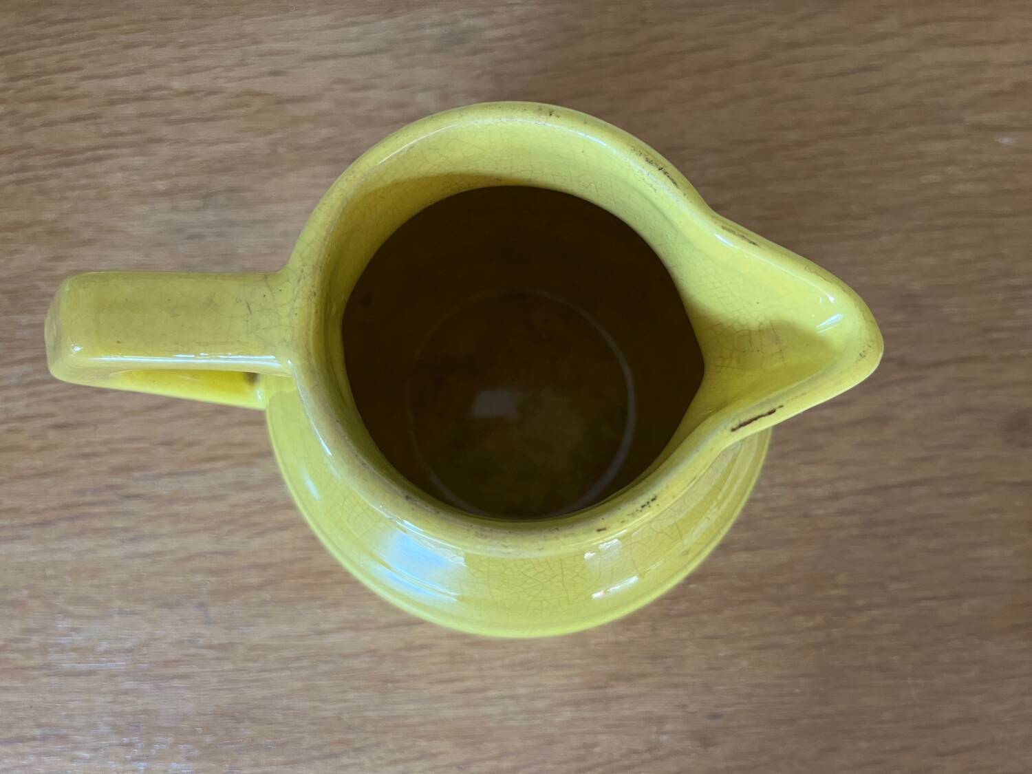 Old yellow ceramic pitcher