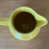 Old yellow ceramic pitcher