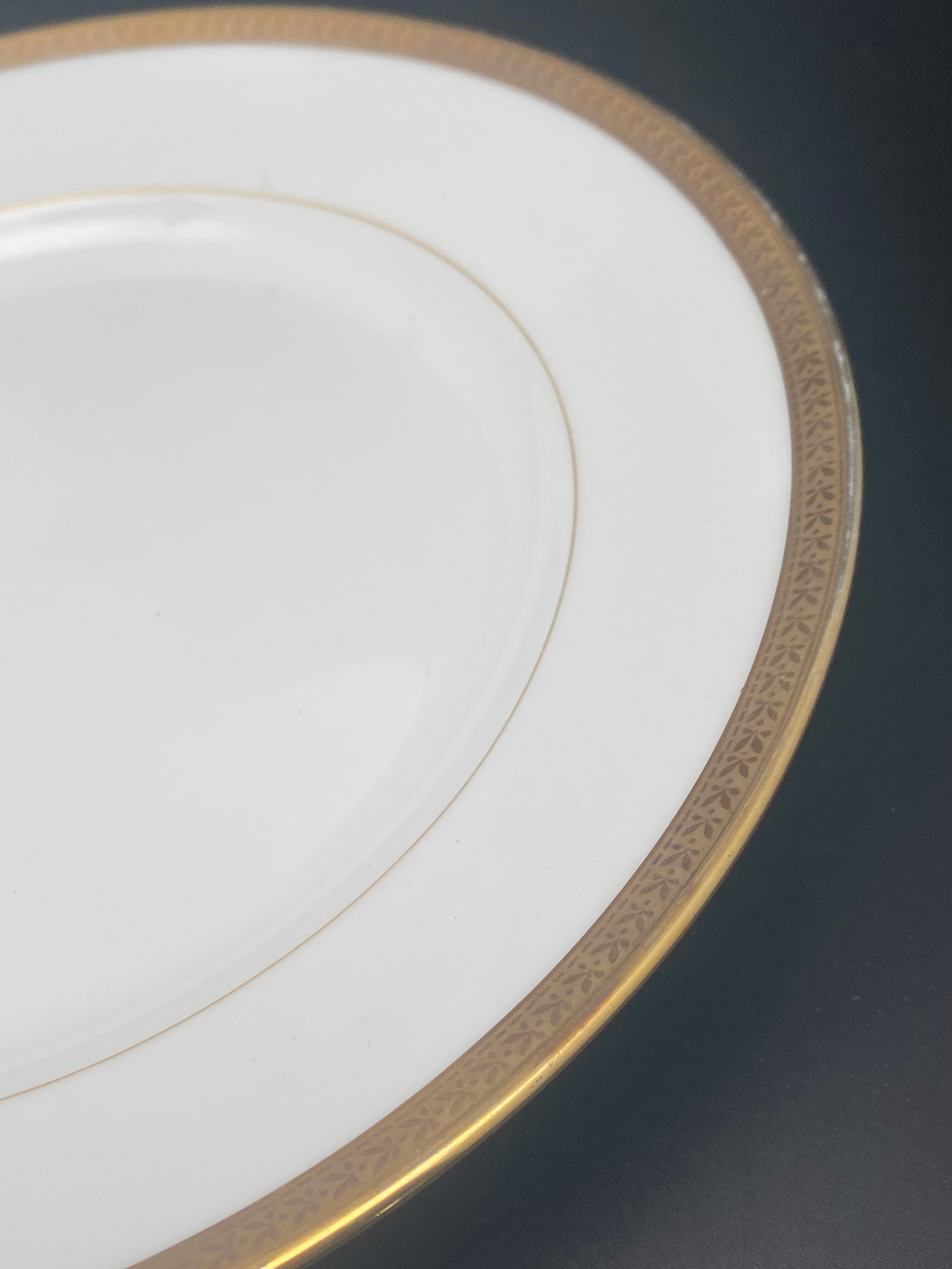 Round porcelain dish from Limoges golden tower