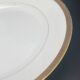 Round porcelain dish from Limoges golden tower