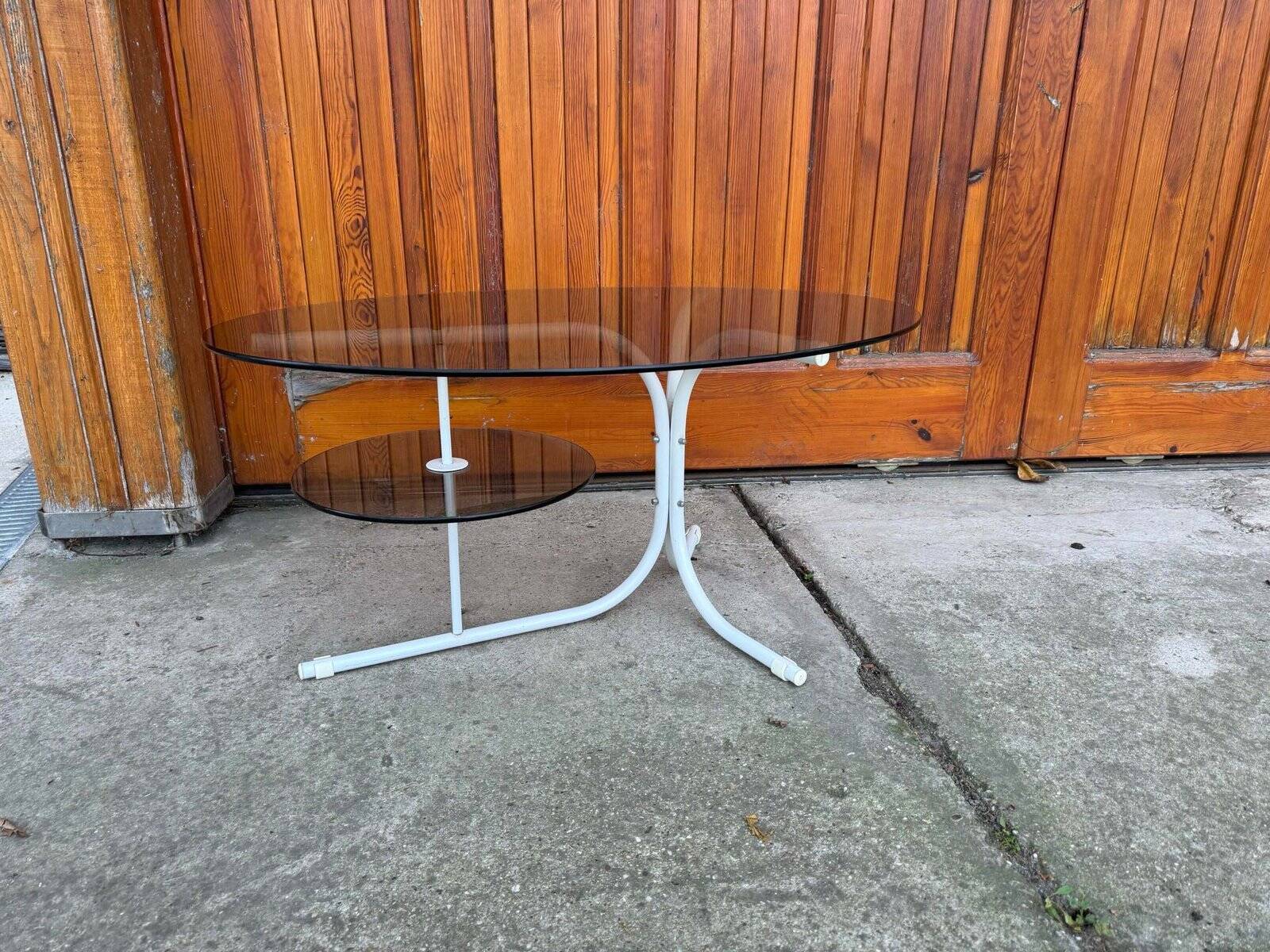 Oval smoked grey glass coffee table with white metal legs - 1990s vintage style.