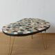 Unusual coffee table on three legs