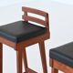 Erik Buck set of three bar stools in teak and leather Dyrlund Denmark 1960