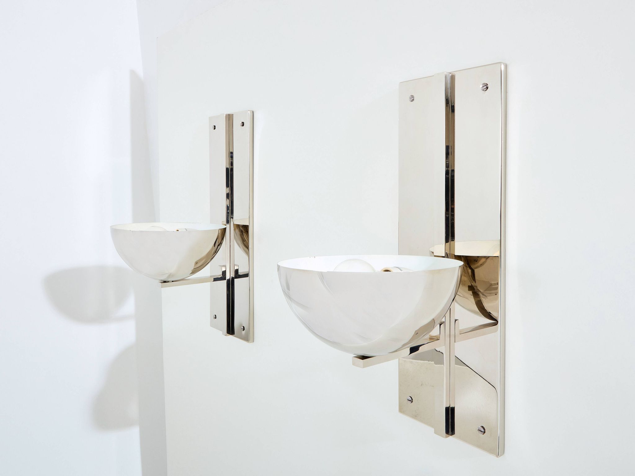Pair of modernist wall lights by Claude Parent, nickel-plated steel, 1992.