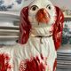 Pair of Staffordshire porcelain Cavalier King Charles dogs on terrace, 19th century.