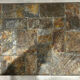 Brutalist-style coffee table made of mixed wrought iron and stone.