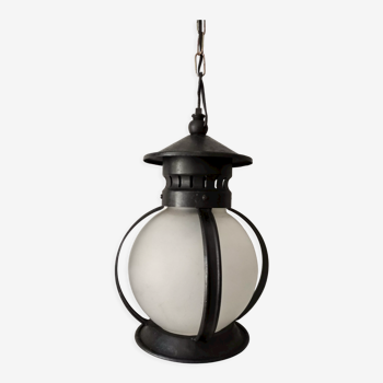 Old globe pendant lamp in opaque glass and black wrought iron