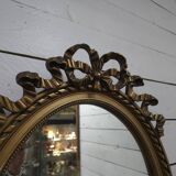 Oval mirror with gold patina