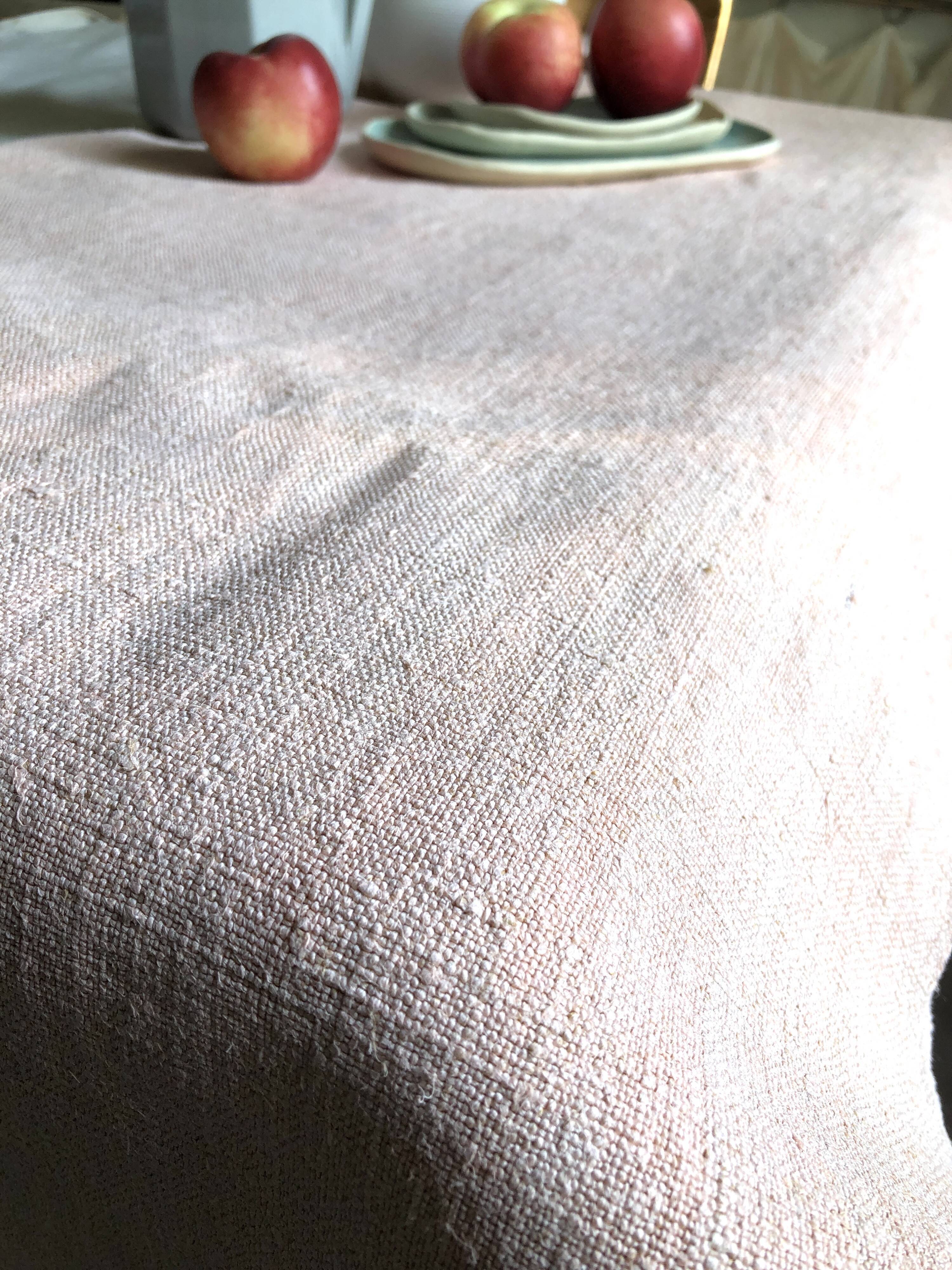 Old hemp harvest tablecloth tinted in pink tea