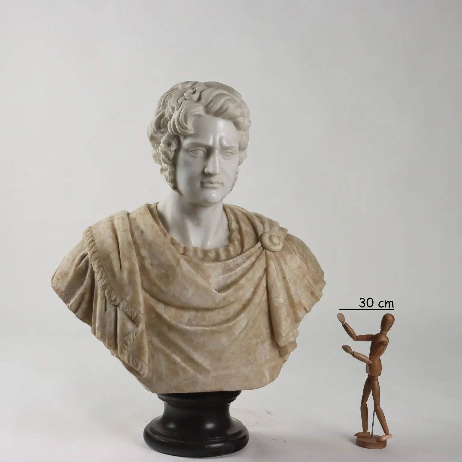 Bust of a Roman emperor in white marble, Italy, 20th century.