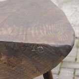 Brutalist tripod coffee table in stained pine, France 1950s