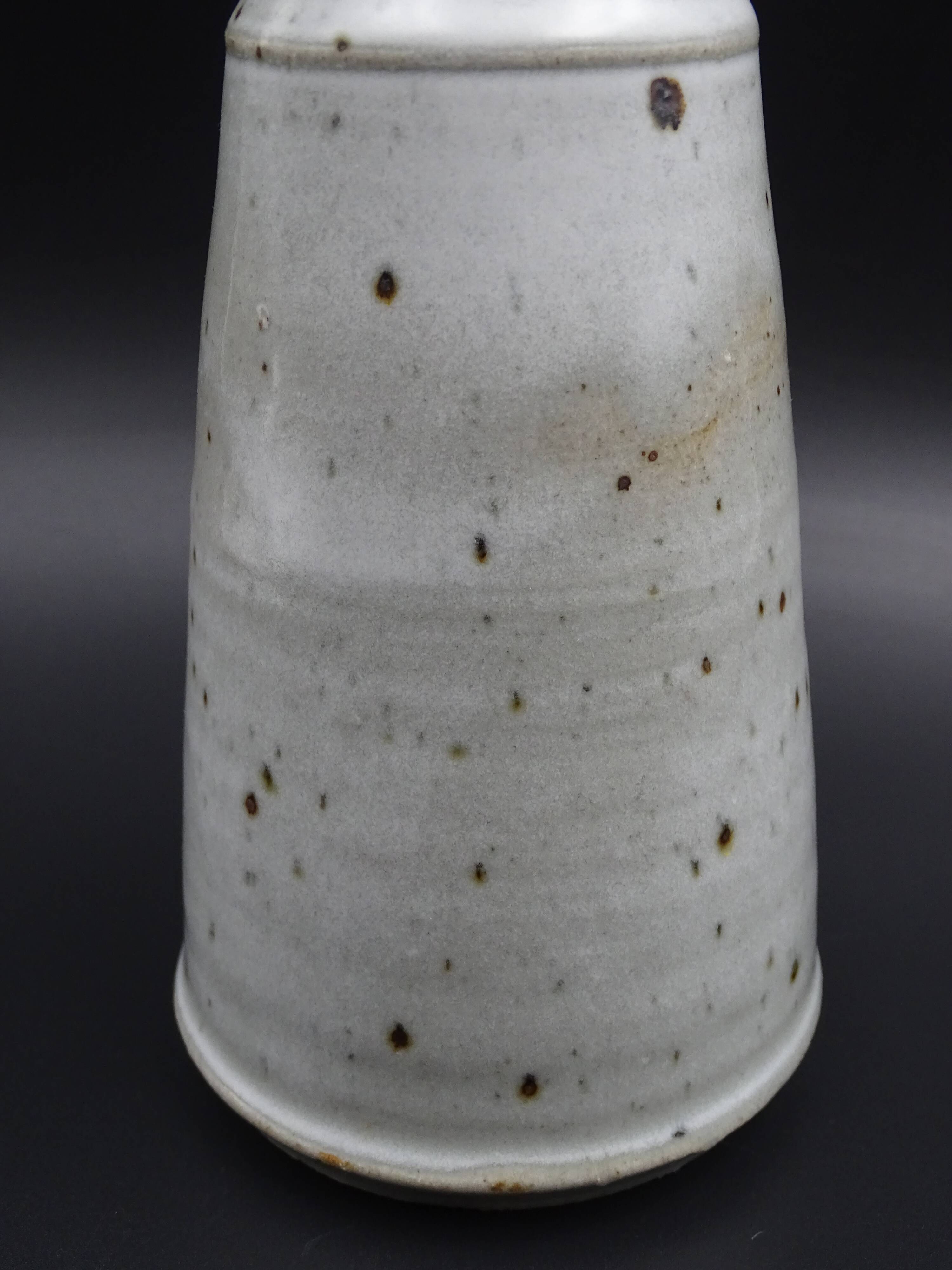 Sandstone vase with brown speckled decoration on a grey background - Bottle shape - Circa 1970 - Signed