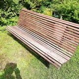 Old wooden bench and wrought iron