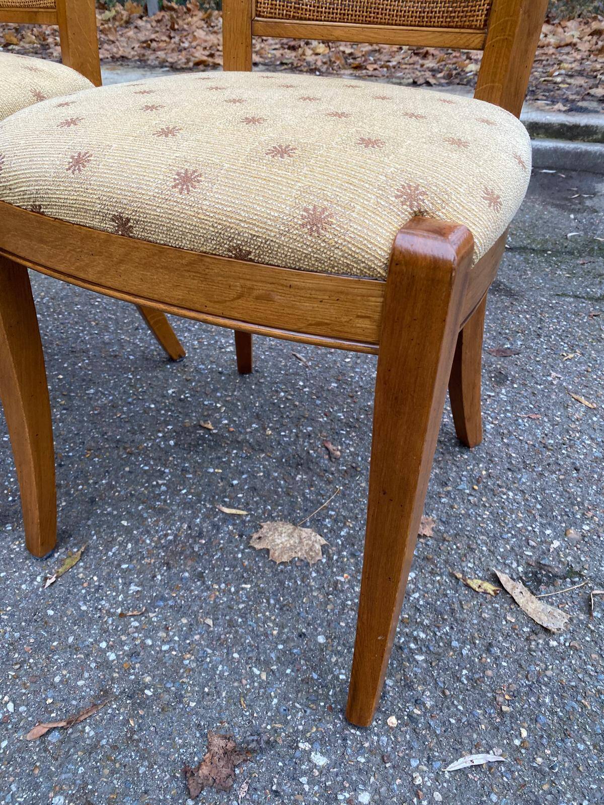 Four 20th-century Directoire-style chairs in solid wood with cane seats and beige fabric