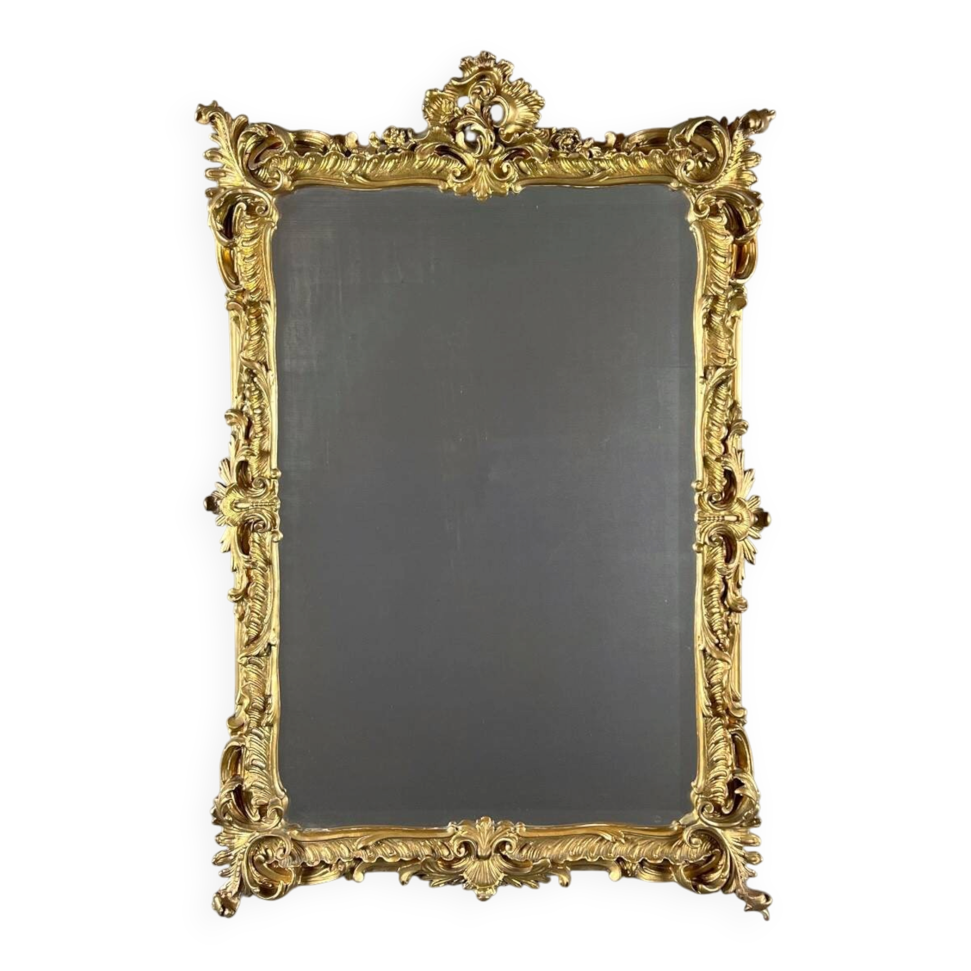 Large gilded wooden mirror in Louis XV style, 19th century.
