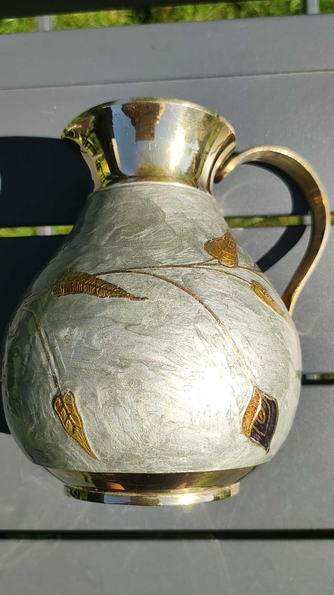 Decorative decanter in solid enamelled brass
