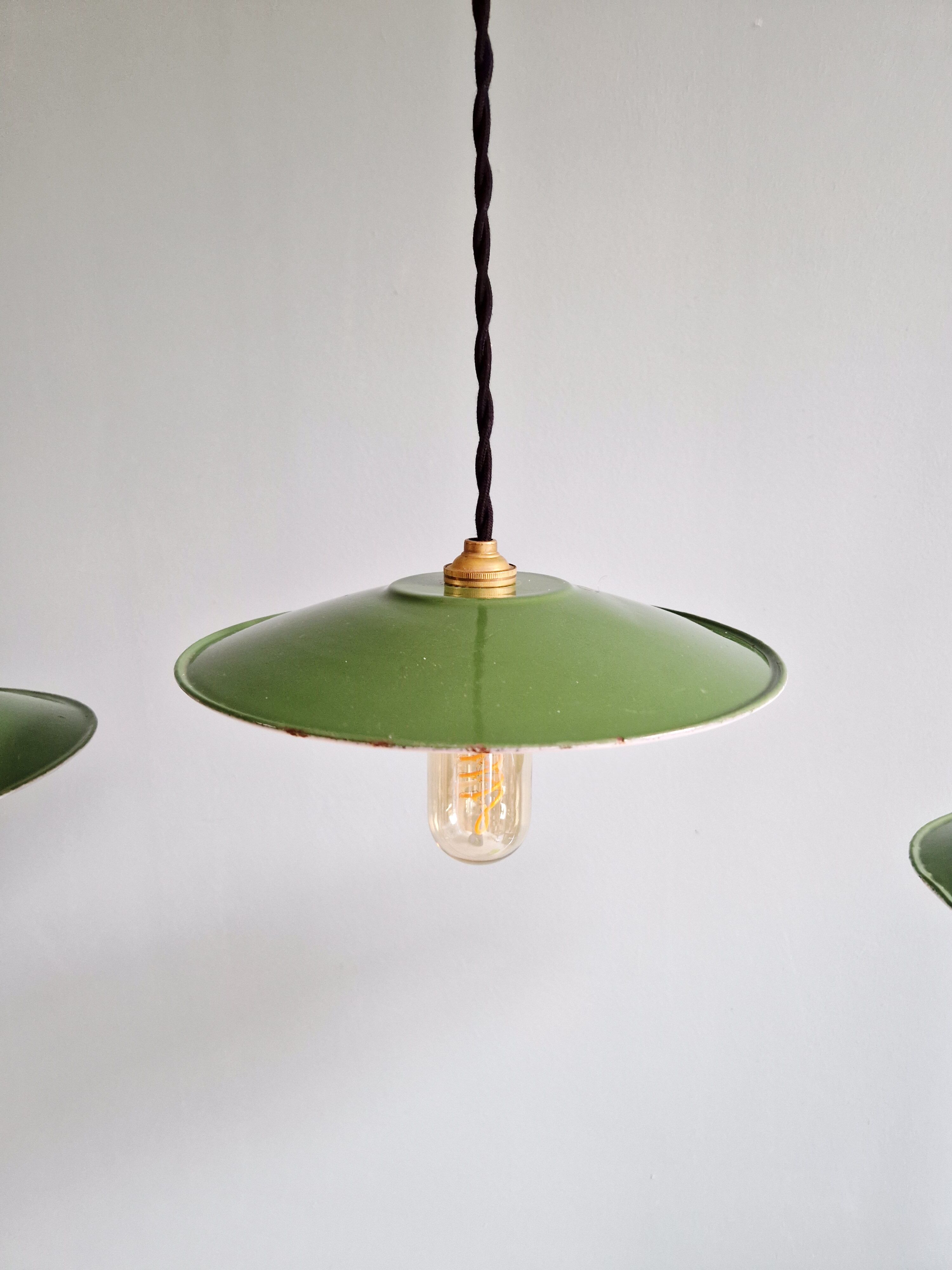 Trio of large industrial suspensions in green enamelled sheet metal.