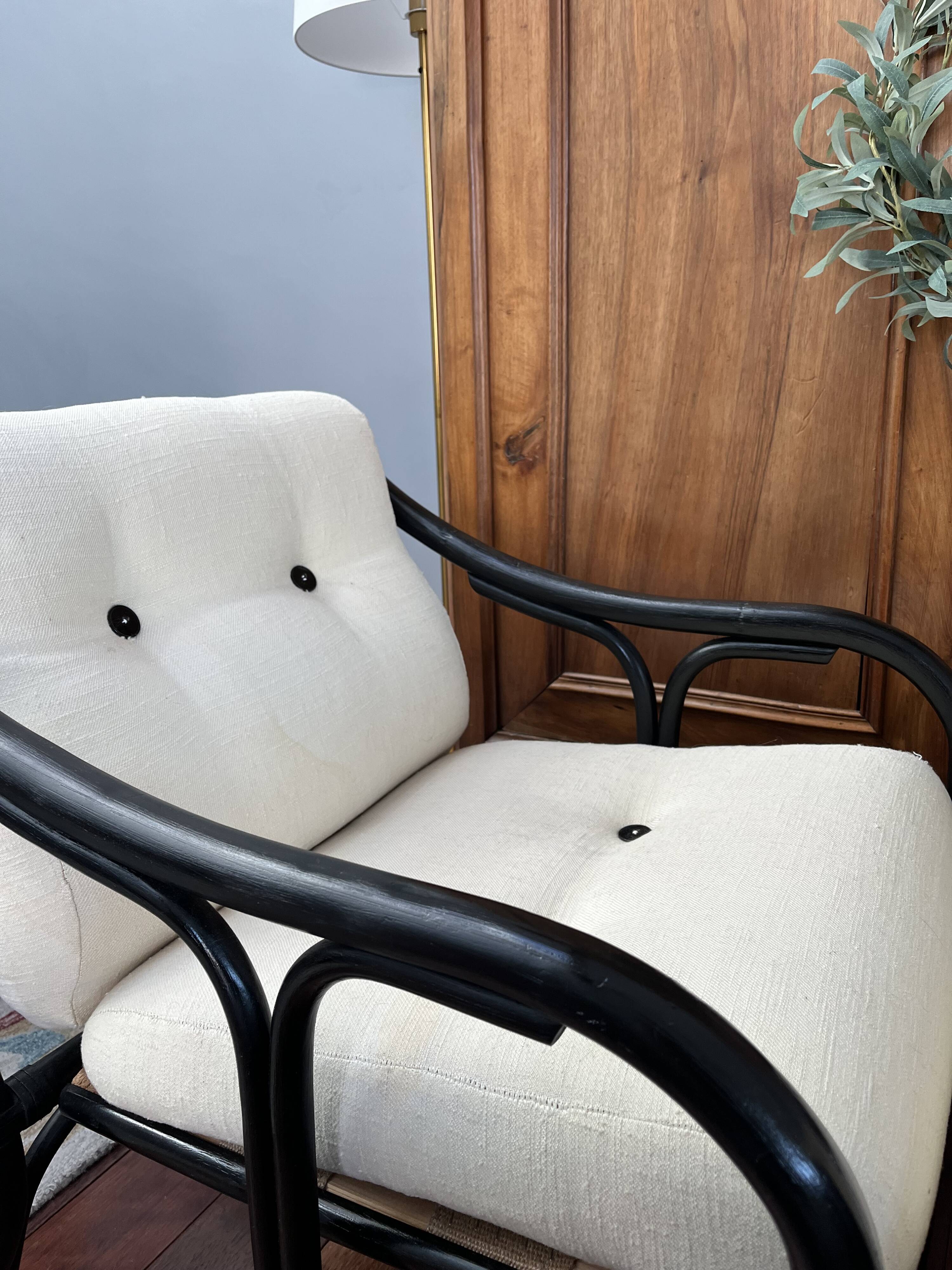 Set of two vintage black and white bamboo chairs.