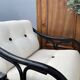 Set of two vintage black and white bamboo chairs.