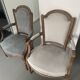 Pair of cabriolet armchairs in light grey and dark grey Louis XV style.