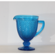 Old table set in blue pressed moulded glass