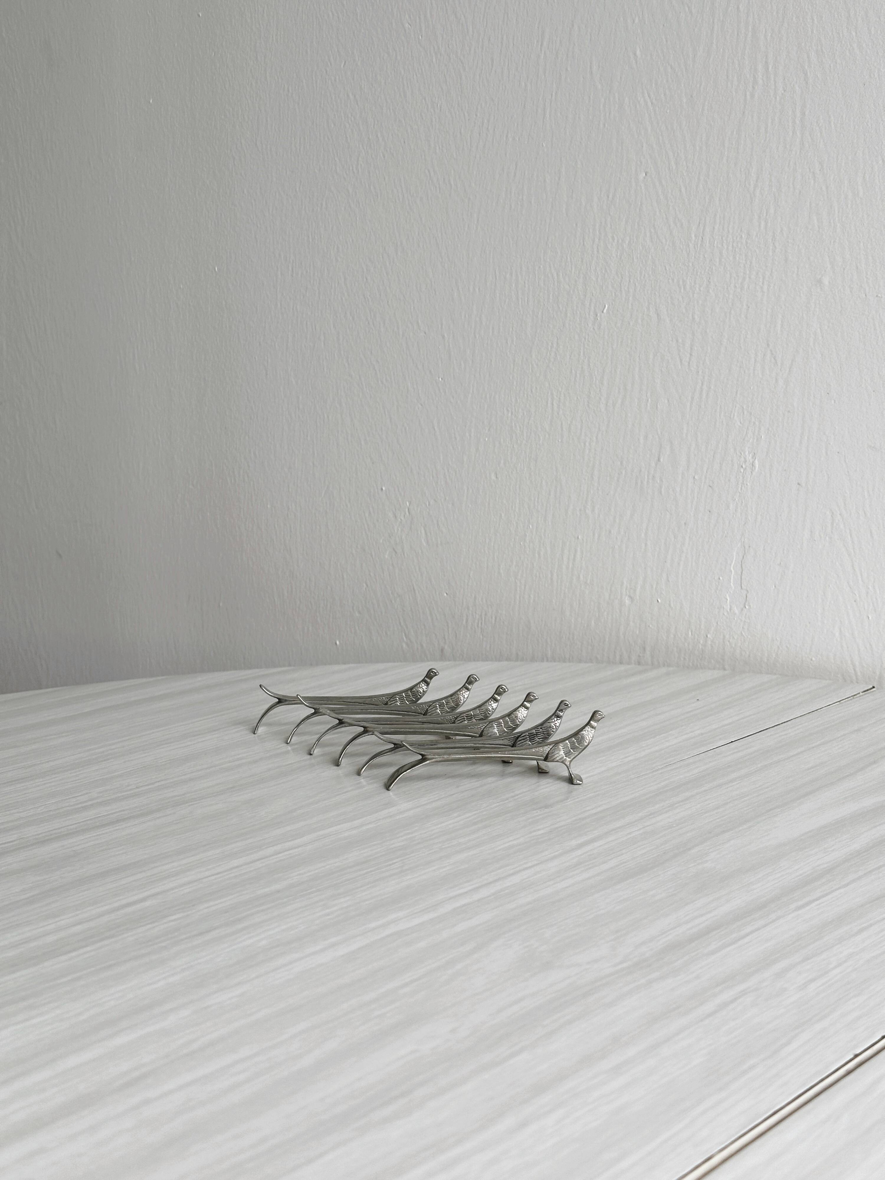 6 silver metal knife holders, pheasant shape