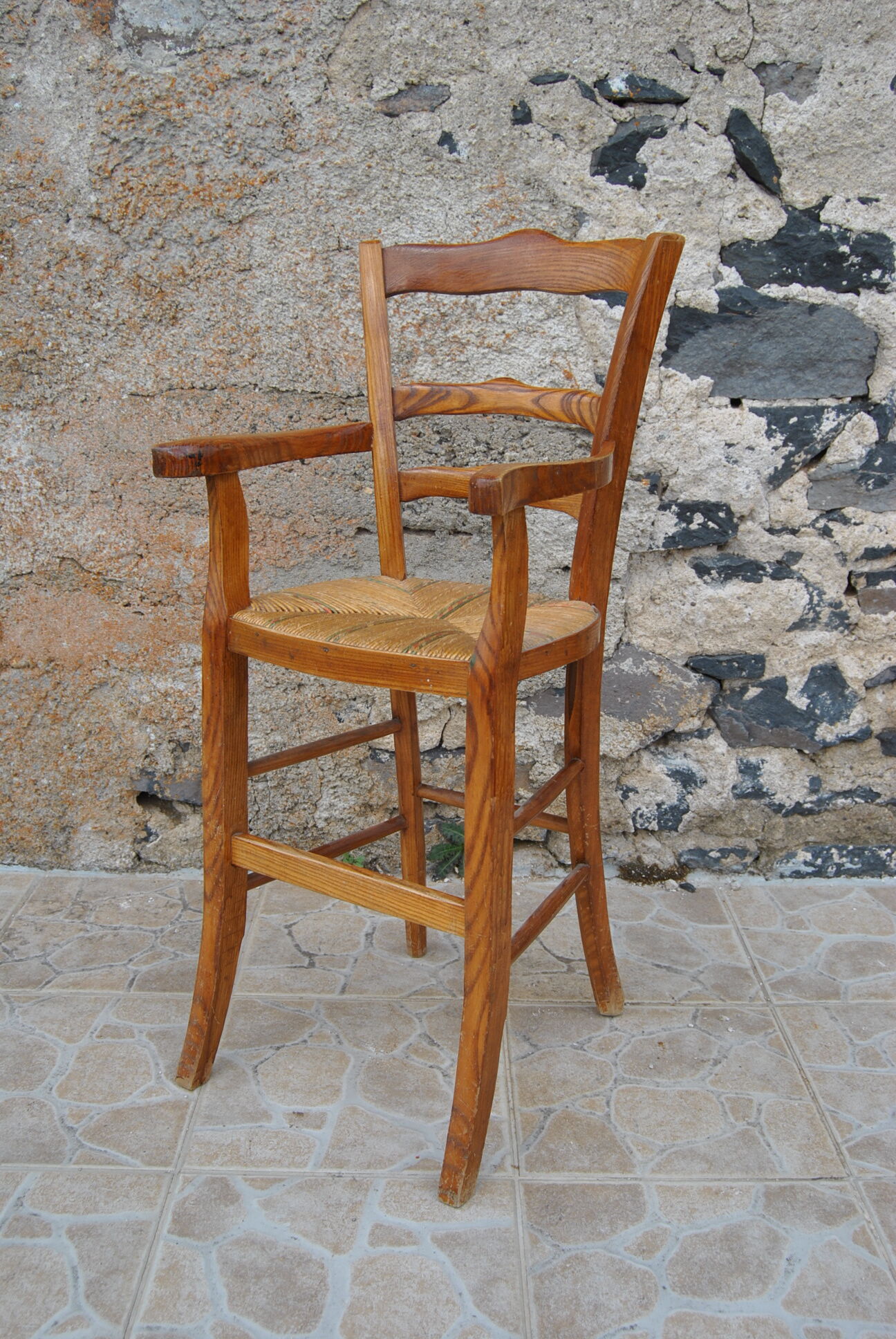 Wooden children's high chair and mulched seat