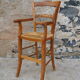 Wooden children's high chair and mulched seat