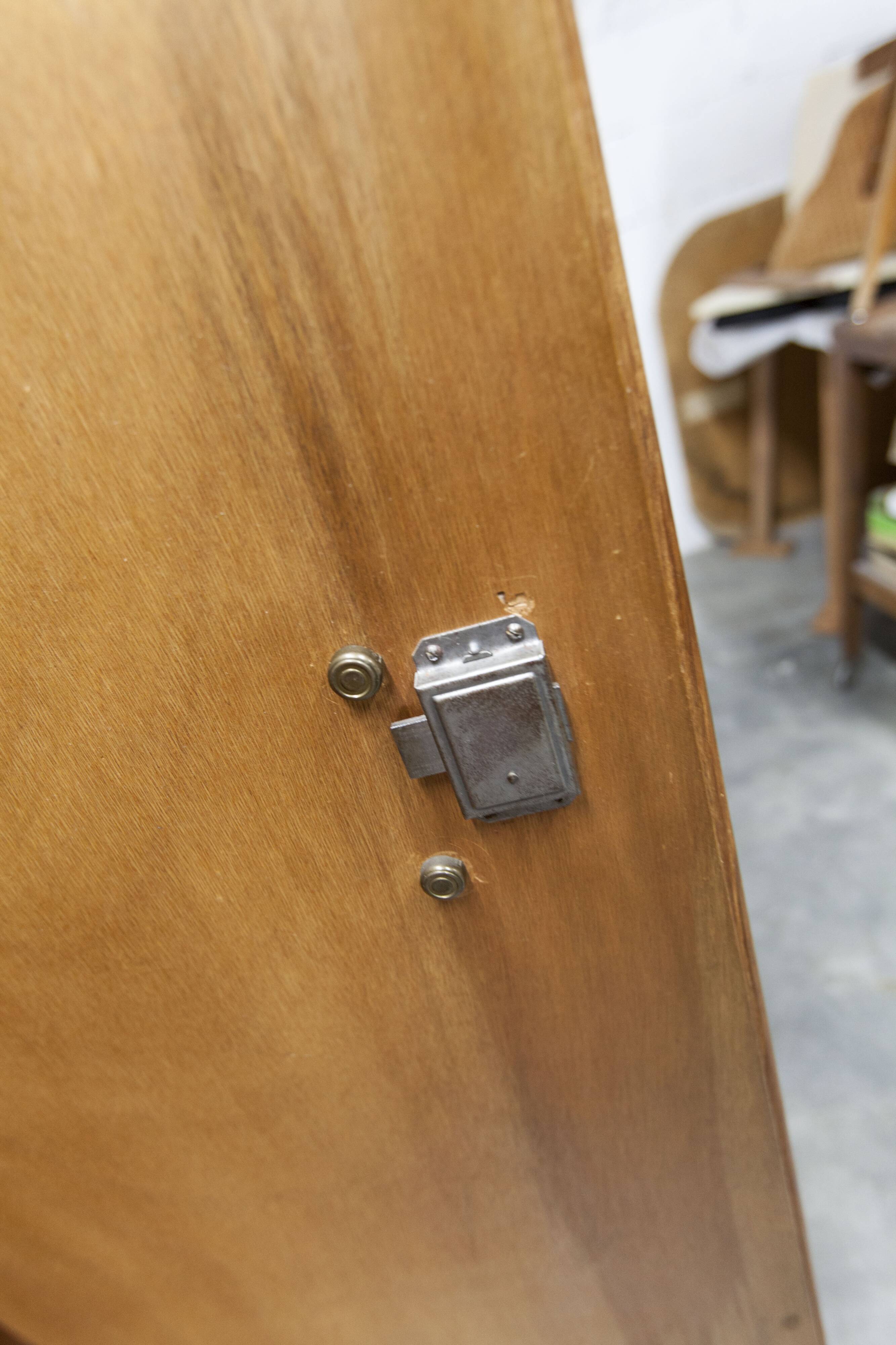 1950s Mid-Century Modern oak armoire with two doors and two drawers.
