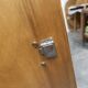 1950s Mid-Century Modern oak armoire with two doors and two drawers.