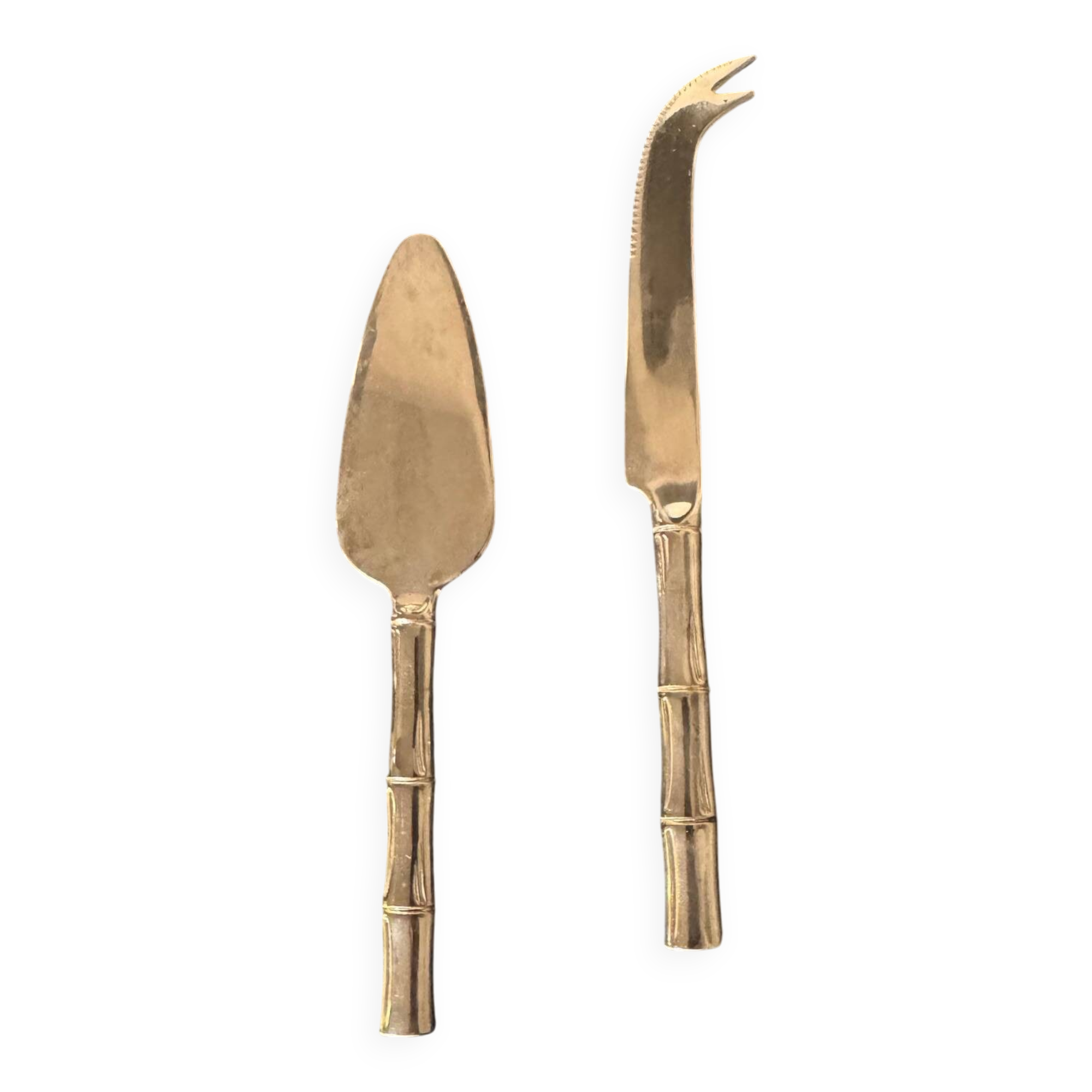 Golden metal cheese cutlery resembling bamboo